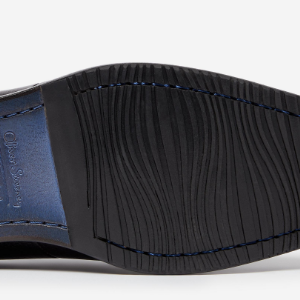 Closeup of Leather sole with rubber forepart