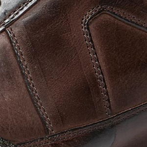 Closeup of Hand-finished calf leather upper with calf suede trim