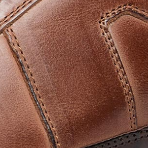 Closeup of Hand-finished calf leather upper with contrast leather trim