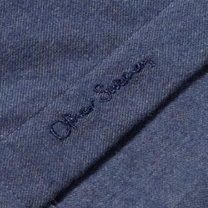 Closeup of Embroidered branding on placket