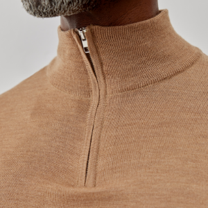 Closeup of Polished metal quarter zip