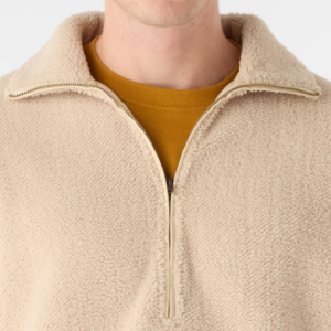 Closeup of Polished metal half zip
