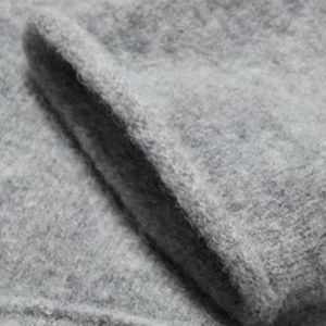 Closeup of Rolled collar, cuffs & hem