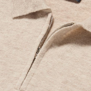 Closeup of Polished metal quarter zip