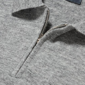 Closeup of Polished metal quarter zip