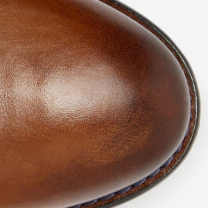 Closeup of Hand-burnished toe