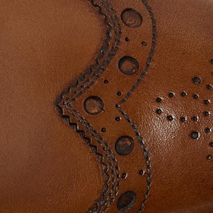 Closeup of Antiqued calf leather upper