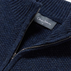 Closeup of Polished metal quarter zip