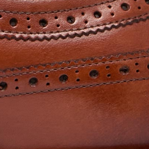Closeup of Antiqued calf leather upper