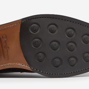 Closeup of Leather sole with cleated rubber forepart