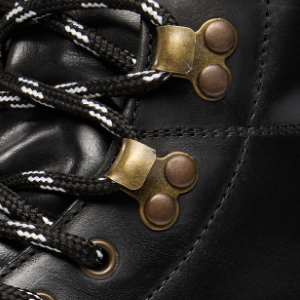 Closeup of Antiqued metal eyelets & ski hooks