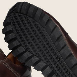 Closeup of Cleated rubber outsole & EVA midsole