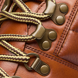 Closeup of Antiqued metal D-rings & ski hooks