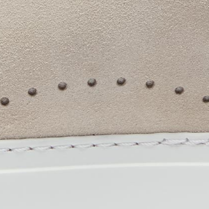 Closeup of Perforated suede detail