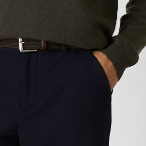 Closeup of 2 front side slanted pockets & 2 rear buttoned pockets