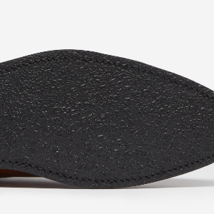 Closeup of Rubber sole with studded rubber heel