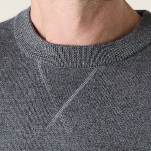 Closeup of V-notch neck detail