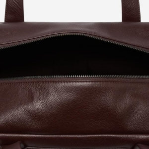 Closeup of 4 internal pouch & zip pockets