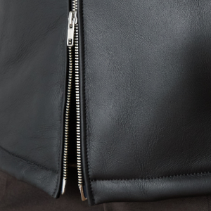 Closeup of Polished metal double zip