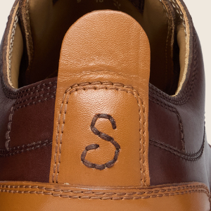 Closeup of Contrast leather heel pull tab