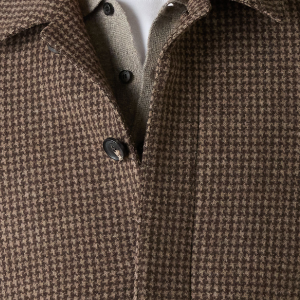 Closeup of Concealed placket with branded horn buttons