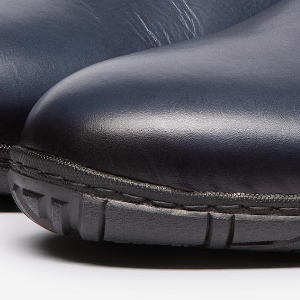 Closeup of Hand antiqued calf leather upper
