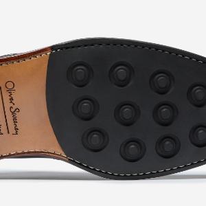 Closeup of Leather sole with cleated rubber heel & forepart