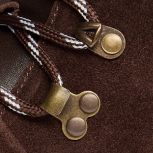 Closeup of Antiqued metal D-rings & ski hooks