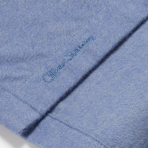 Closeup of Embroidered branding on placket