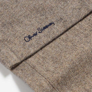 Closeup of Embroidered branding on placket